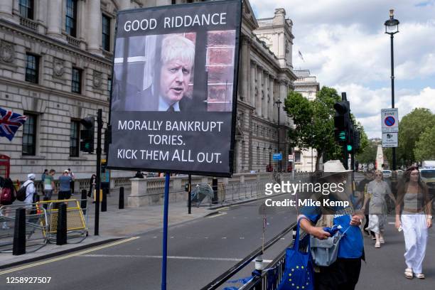 Anti-Brexit protesters continue their campaign against Brexit and the Conservative government in Westminster with a placard featuring Boris Johnson...