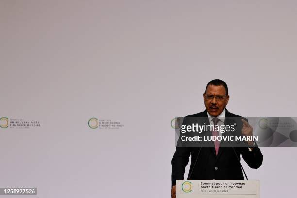 President of Niger, Mohamed Bazoum delivers a speech during the opening session of the New Global Financial Pact Summit at the Palais Brongniart in...