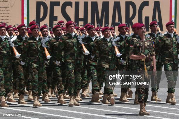Iraqi-Kurdish Peshmerga officers take part in a graduation ceremony in Arbil, the capital of Iraq's northern autonomous Kurdish region, on June 22,...