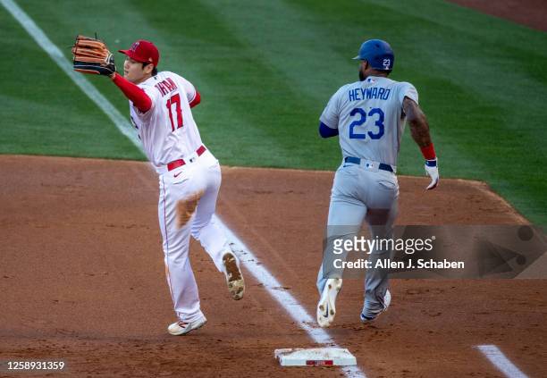Anaheim, CA Dodgers baserunner Jason Heyward is safe at first base as Angels starting pitcher Shohei Ohtani can't get the ball in time at Angel...