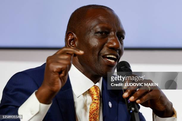 Kenyan President William Ruto speaks as he takes part in a round table to discuss global economy during the New Global Financial Pact Summit at the...