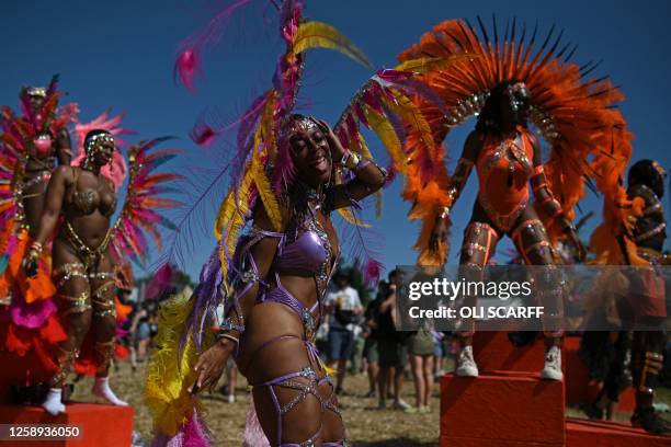 Performers from the Notting Hill Carnival dance on Day 2 of the Glastonbury festival in the village of Pilton in Somerset, southwest England, on June...