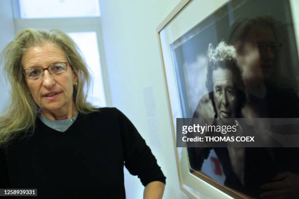 Photographer Annie Leibovitz poses in front of one of her pictures featuring her mother during the inauguration of her exhibition, "A Photographer's...