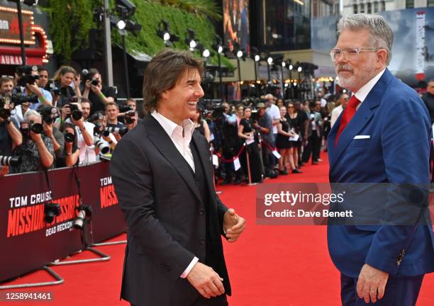 Tom Cruise and Christopher McQuarrie attend the UK Premiere of "Mission: Impossible - Dead Reckoning Part One" at Odeon Luxe Leicester Square on June...