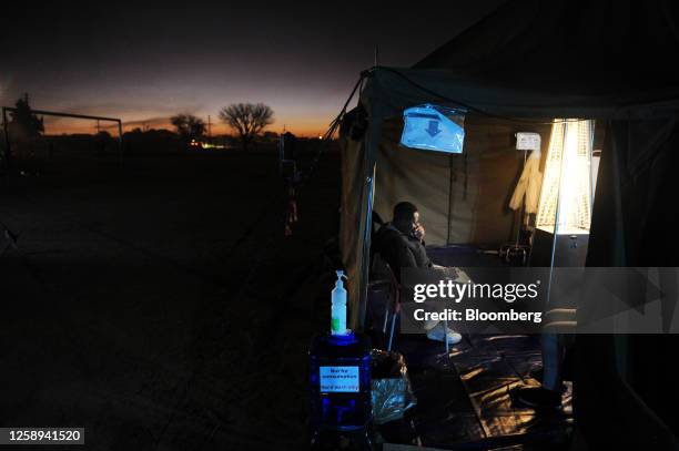 Nurse doing paperwork inside a tent in the Kanana informal settlement in Hammanskraal, South Africa, on Saturday, June 10, 2023. South Africa's worst...