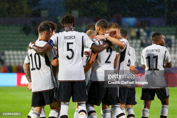 Yann Bisseck of Germany celebrates after scoring his team's first goal with teammates during the UEFA Under-21 Euro 2023 match between Germany and...
