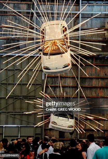 Stage One , a work by Chinese New York based artist Cai Guo-Qiang, which shows suspended cars in an animated sequence of explosion, is displayed as...