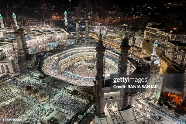 In this elevated view from a hotel overlooking the Grand Mosque, Muslim worshippers and pilgrims gather around the Kaaba, Islam's holiest shrine, in...