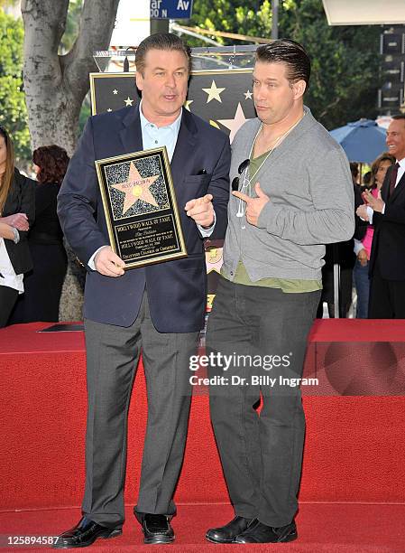 Actors Alec Baldwin and his brother Stephen Baldwin pose during Alec Baldwin's Hollywood Walk of Fame Induction Ceremony on February 14, 2011 in...
