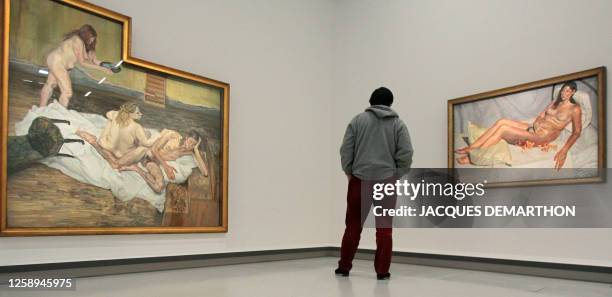 Person looks at "After Cezanne" and "Irishwoman on a bed" two paintings of Britain's Lucian Freud, grandson of Sigmund Freud, at the Georges Pompidou...