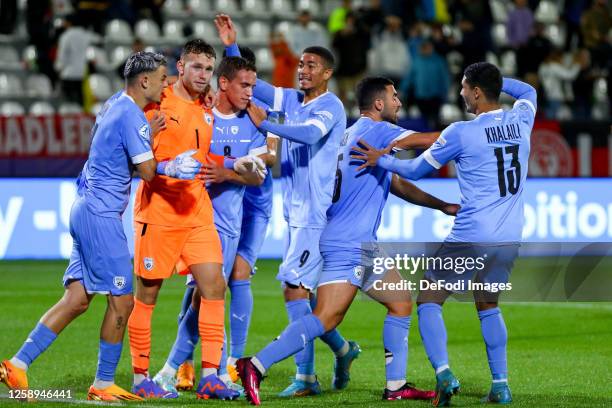 Israel's players cheer goalkeeper Daniel Peretz of Israel for saving the penalty during the UEFA Under-21 Euro 2023 match between Germany and Israel...