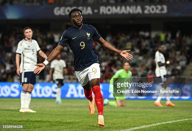 Arnaud Kalimuendo Muinga of France celebrates after scoring his side's first goal during the UEFA Under-21 EURO 2023 Finals Group D match between...