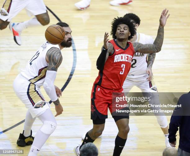 Houston Rockets guard Kevin Porter Jr. Loses the ball against New Orleans Pelicans center Steven Adams and New Orleans Pelicans guard Lonzo Ball...