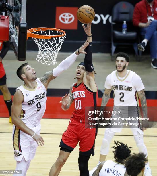 Houston Rockets forward D.J. Wilson goes up for a basket against New Orleans Pelicans center Willy Hernangomez during the second half of an NBA...