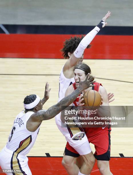 Houston Rockets forward Kelly Olynyk collides with New Orleans Pelicans center Jaxson Hayes during the second half of an NBA basketball game at...