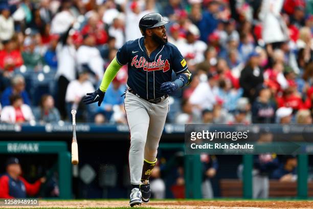 Marcell Ozuna of the Atlanta Braves watches his two-run home run against the Philadelphia Phillies during the 10th inning of a game at Citizens Bank...