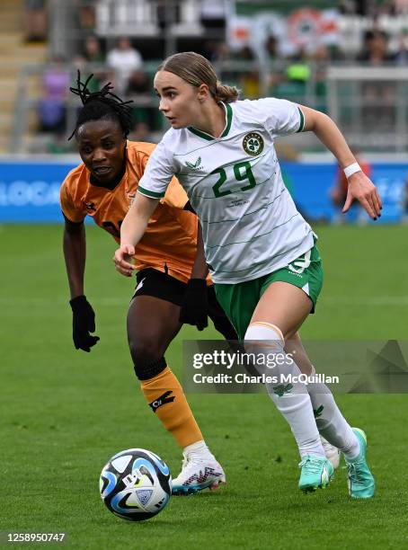 Izzy Atkinson of Republic of Ireland and Siomara Mapepa of Zambia fight for possession during the women's international football friendly game...