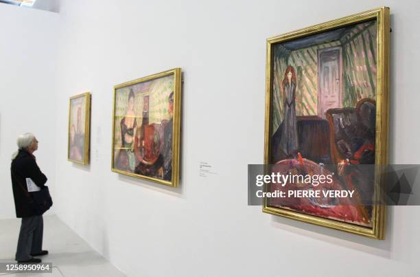 Visitor looks at the painting "La Meurtriere" at the Centre Pompidou modern art museum, also known as the 'Centre Beaubourg', during the Edvard Munch...