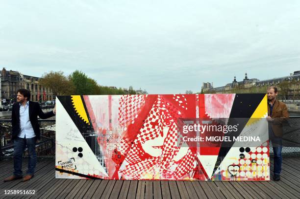 Painting by artists Dag and Russian Artof Popof is presented on the Pont des Arts bridge on April 5, 2011 in the center of Paris as part of Microsoft...