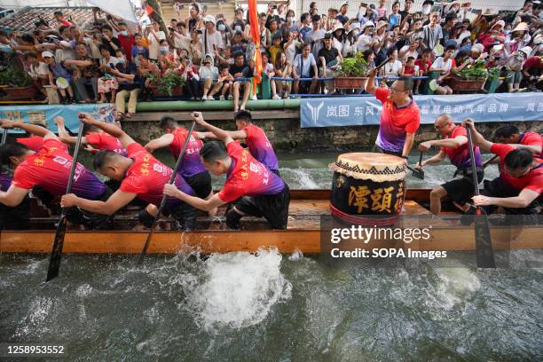 Participants compete in a dragon boat race. The Dragon Boat Festival is a traditional Chinese festival. This is the first time the festival has been...