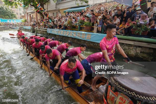 Participants compete in a dragon boat race. The Dragon Boat Festival is a traditional Chinese festival. This is the first time the festival has been...