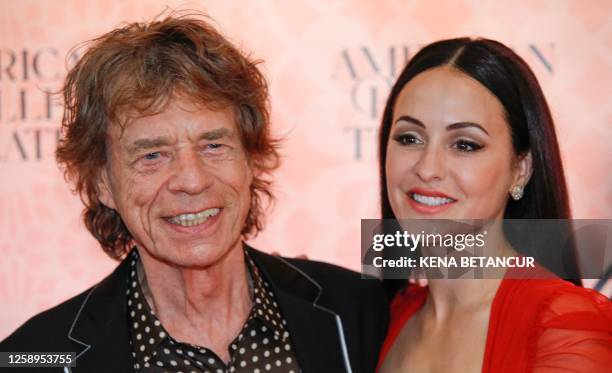 English singer Mick Jagger and his wife US choreographer Melanie Hamrick attend the 2023 American Ballet Theatre's summer season opening night...