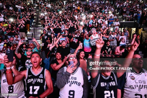 Fans cheer before French basketball player Victor Wembanyama is selected as San Antonio Spurs's No. 1 pick during an NBA Draft Watch Party at the...
