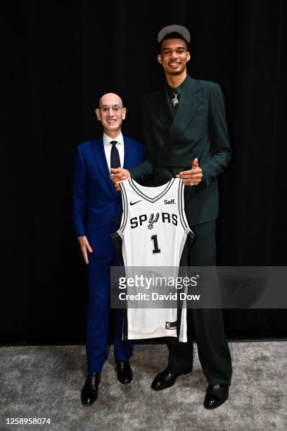 Adam Silver poses for a photo with Victor Wembanyama after being drafted number one overall by the San Antonio Spurs during the 2023 NBA Draft on...