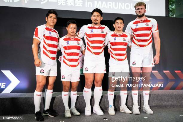 Japan's Rikiya Matsuda, Naoto Saito, Kazuki Himeno, Lee Seung-sin and Warner Dearns pose for photographs during the 2023 Rugby World Cup jersey...