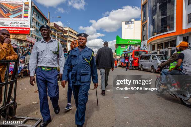 Pedestrians and hawkers walk through the busy streets of Nairobi Central Business District in Kenya.