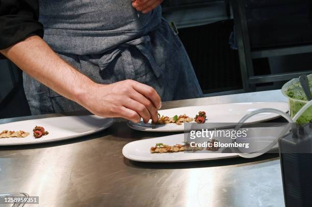Chef plates a plant-based lamb kebab dish, for guests during a tasting session at the Archer-Daniels-Midland Co. Innovation Food Lab in Manchester,...