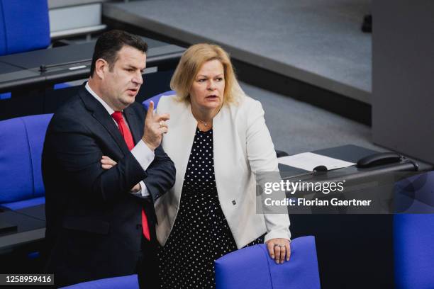 Hubertus Heil, German Minister of Work and Social Issues, and Nancy Faeser, German Minister for Interior and Community, are pictured during the...