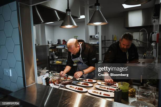 Chefs plate a plant-based lamb kebab dish, for guests during a tasting session at the Archer-Daniels-Midland Co. Innovation Food Lab in Manchester,...