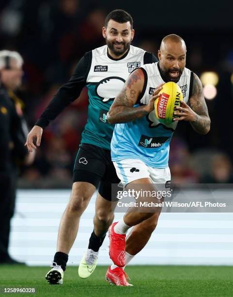 Archie Thompson in action as part of the Spud's Game Curtain Raiser during the 2023 AFL Round 15 match between the St Kilda Saints and the Brisbane...