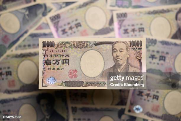 Japanese yen banknotes of various denominations are arranged in Kawasaki, Japan, on Friday, June 23, 2023. Tokyos FX traders are scanning the...