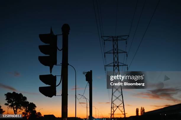 Nonfunctioning traffic lights on a darkened street during a power shutdown, known locally as loadshedding, in the evening in Johannesburg, South...