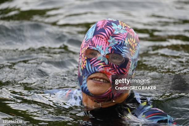 Woman swims in a canal during a heatwave in Beijing on June 23, 2023. China issued its highest-level heat alert for northern parts of the country on...