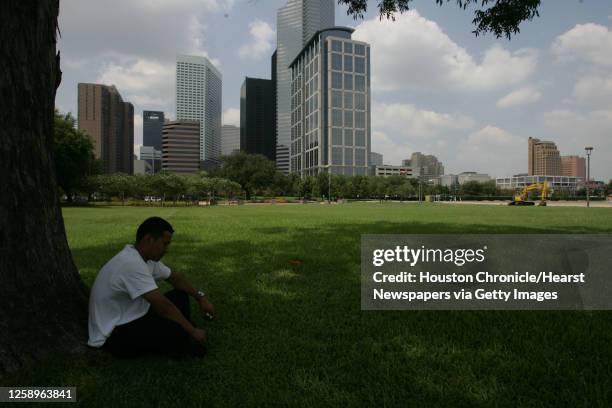 David Alexander sits under a tree in the open space across from the George R. Brown Convention Center Tuesday, Aug. 23 in downtown Houston. This site...