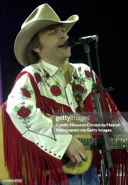 Dwight Yoakam sings as he opens for Brooks and Dunn Saturday, June 22 in The Woodlands, Texas. HOUCHRON CAPTION : THE HEART OF A ROCKER BEATS INSIDE...