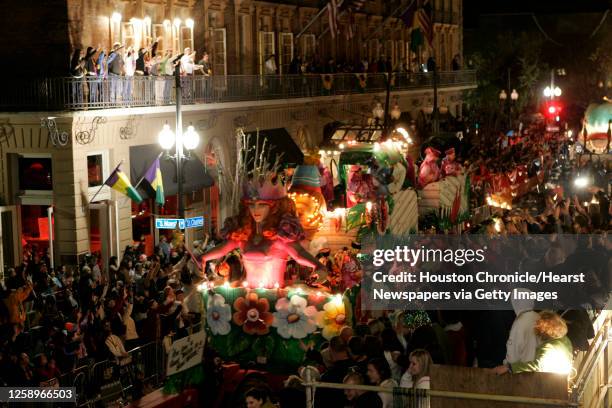 Mardi Gras revelers watch and cheer as Wizard of Oz themed floats roll down St. Charles Avenue during the Bacchus parade Sunday, Feb. 26 in New...