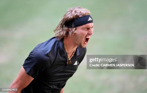 Germany's Alexander Zverev reacts after defeating Chile's Nicolas Jarry in the men's singles quarter-final tennis match during the ATP 500 Halle Open...