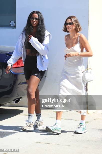 Hailey Bieber and Justine Skye are seen walking out and about on June 22, 2023 in Los Angeles, California.