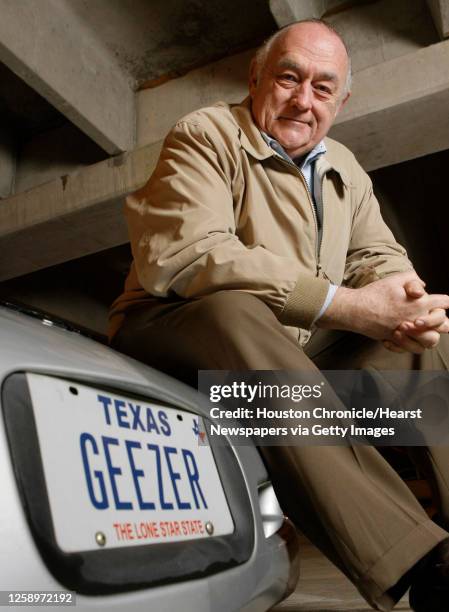 Robert Vienneau poses for a portrait near his Corvette adorned with the vanity license plate GEEZER Friday, Jan. 25 in Houston. GEEZER is a license...