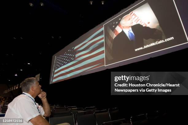 George House, of Caldwell County, watches a John McCain video presentation during the Texas Republican Party Convention at the George R. Brown...