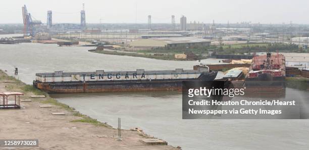 Barges are stacked up at a railroad bridge along the inner harbor navigation canal off the Industrial Canal that were left in the wake of Hurricane...