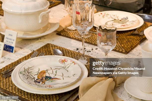 Gien fine china is shown with Baccarat stemware, on a placemat and napkin ring by Kim Seybert, witih Ricci flatware at Kuhl-Linscomb Friday, Aug. 29...