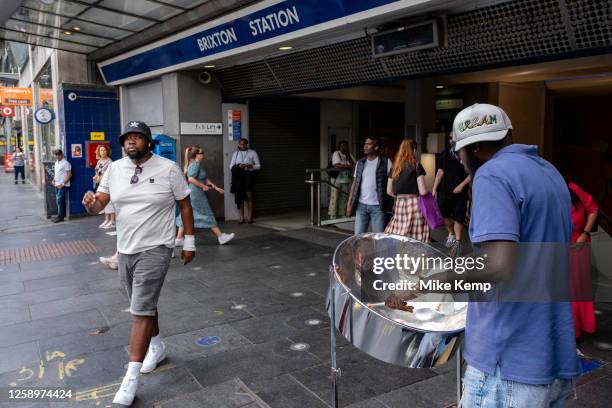 Man playing the steel drums outside Brixton underground station in the diverse community of Brixton on 22nd June 2023 in London, United Kingdom....