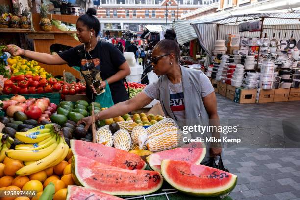 Watermelon slices for sale in the vibrant Brixton Market on Electric Avenue in the diverse community of Brixton on 22nd June 2023 in London, United...