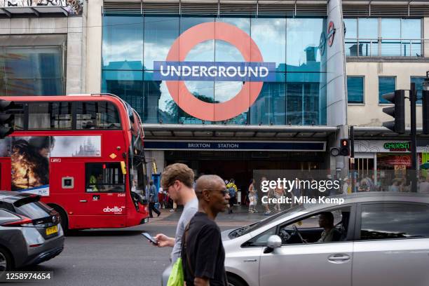 Street scene as people cross the road to and from Brixton underground station in the diverse community of Brixton on 22nd June 2023 in London, United...