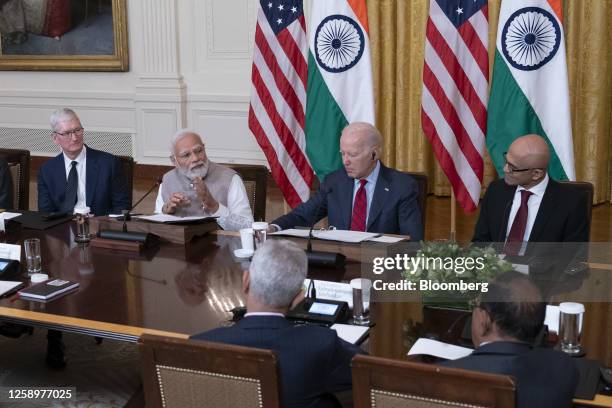 Tim Cook, chief executive officer of Apple Inc., from left, Narendra Modi, India's prime minister, US President Joe Biden, and Satya Nadella, chief...